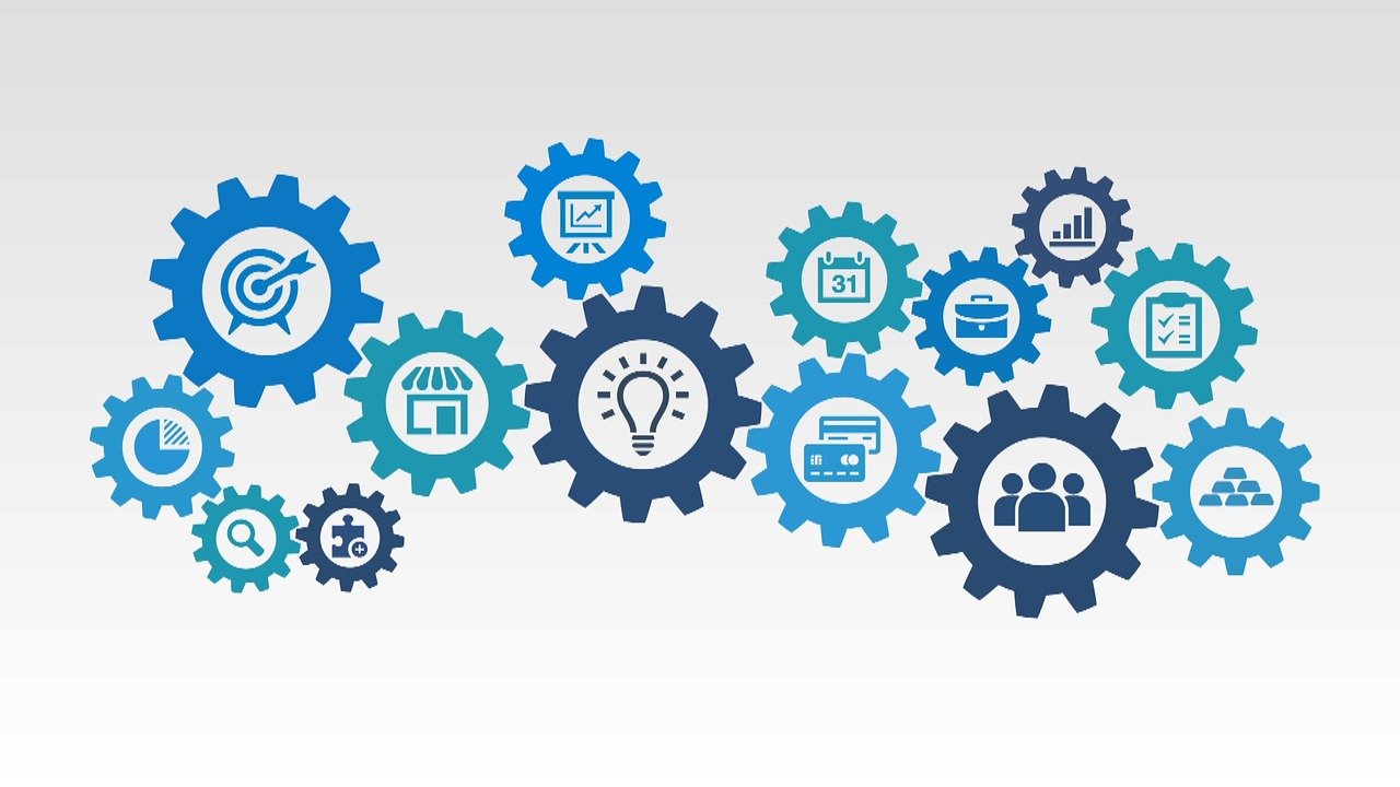 Cogs with various ifferent icons overlaid.